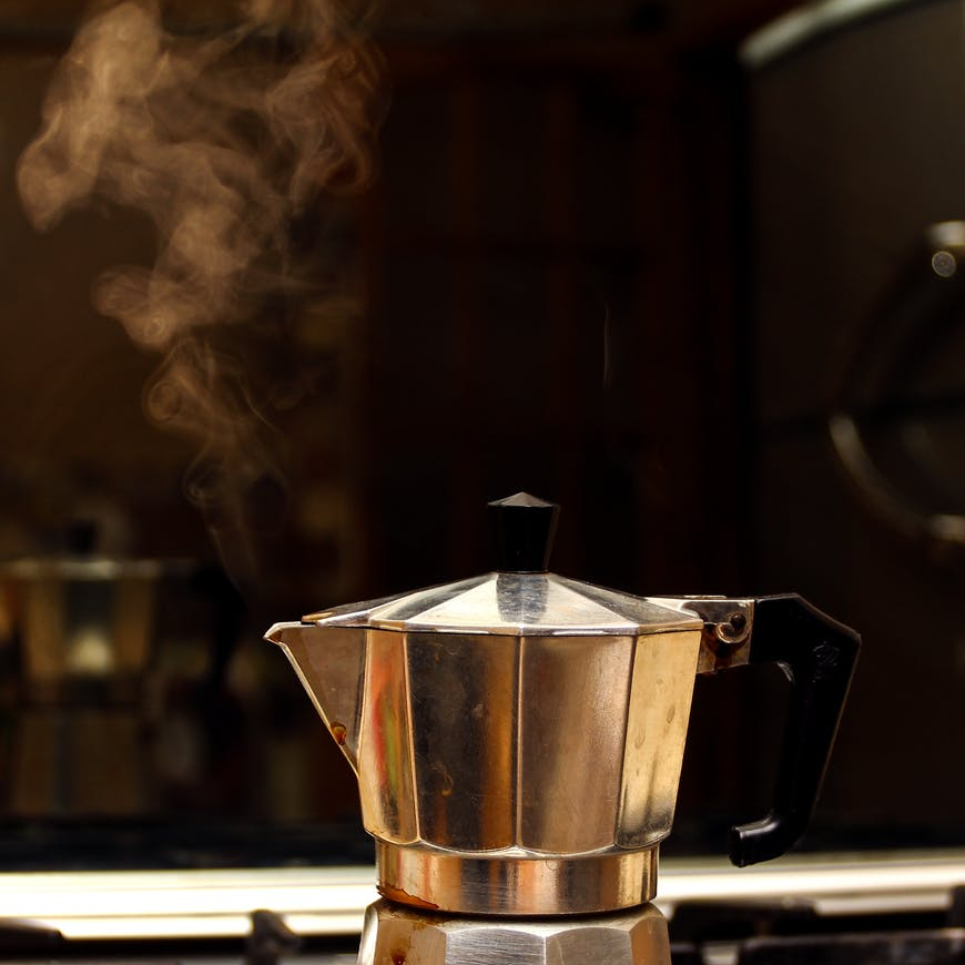 stainless steel coffee maker on stove